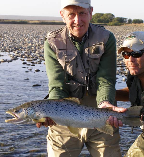 Pat with a monster brown trout that he caught in the Limay River in 2008